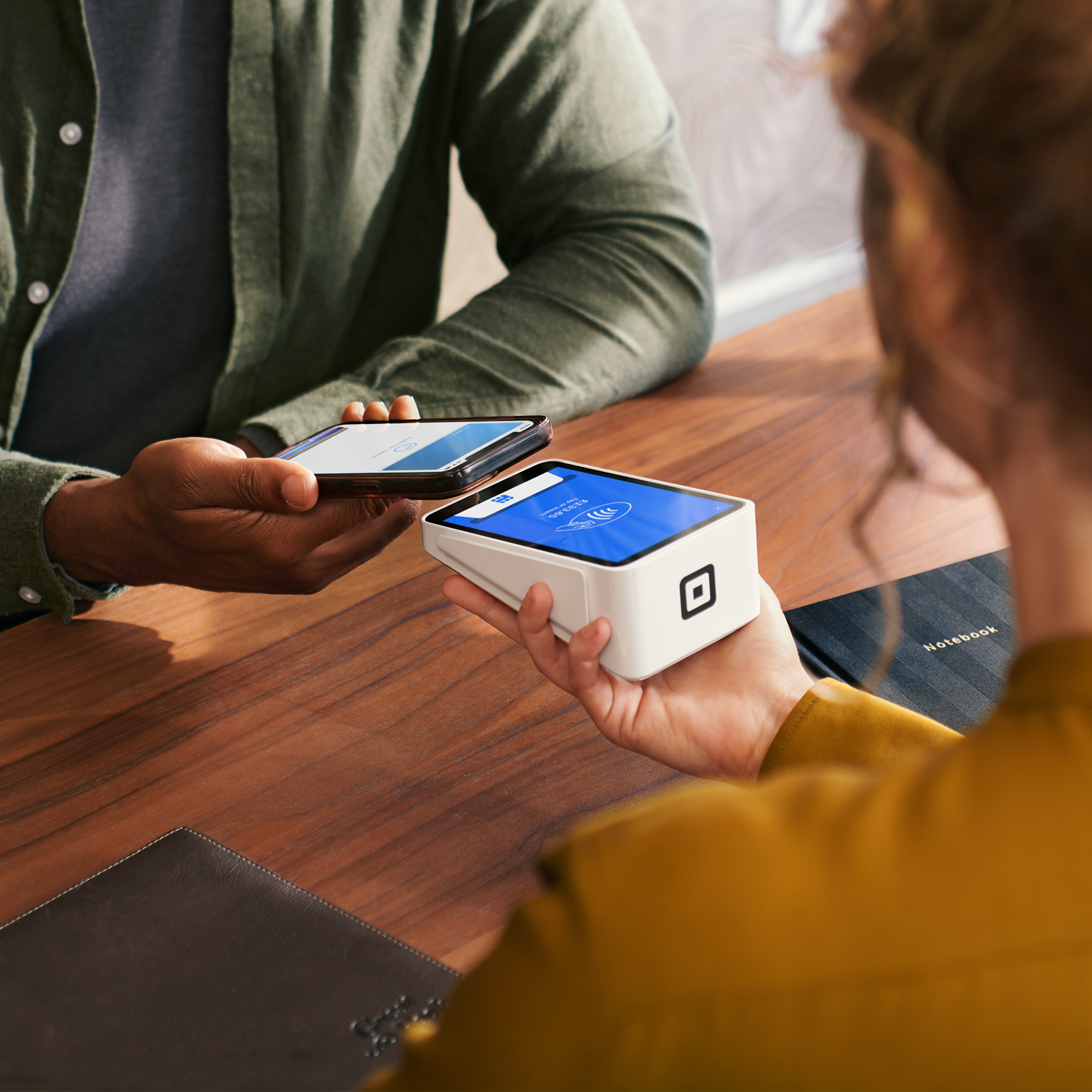 User tapping NFC crypto card on smartphone